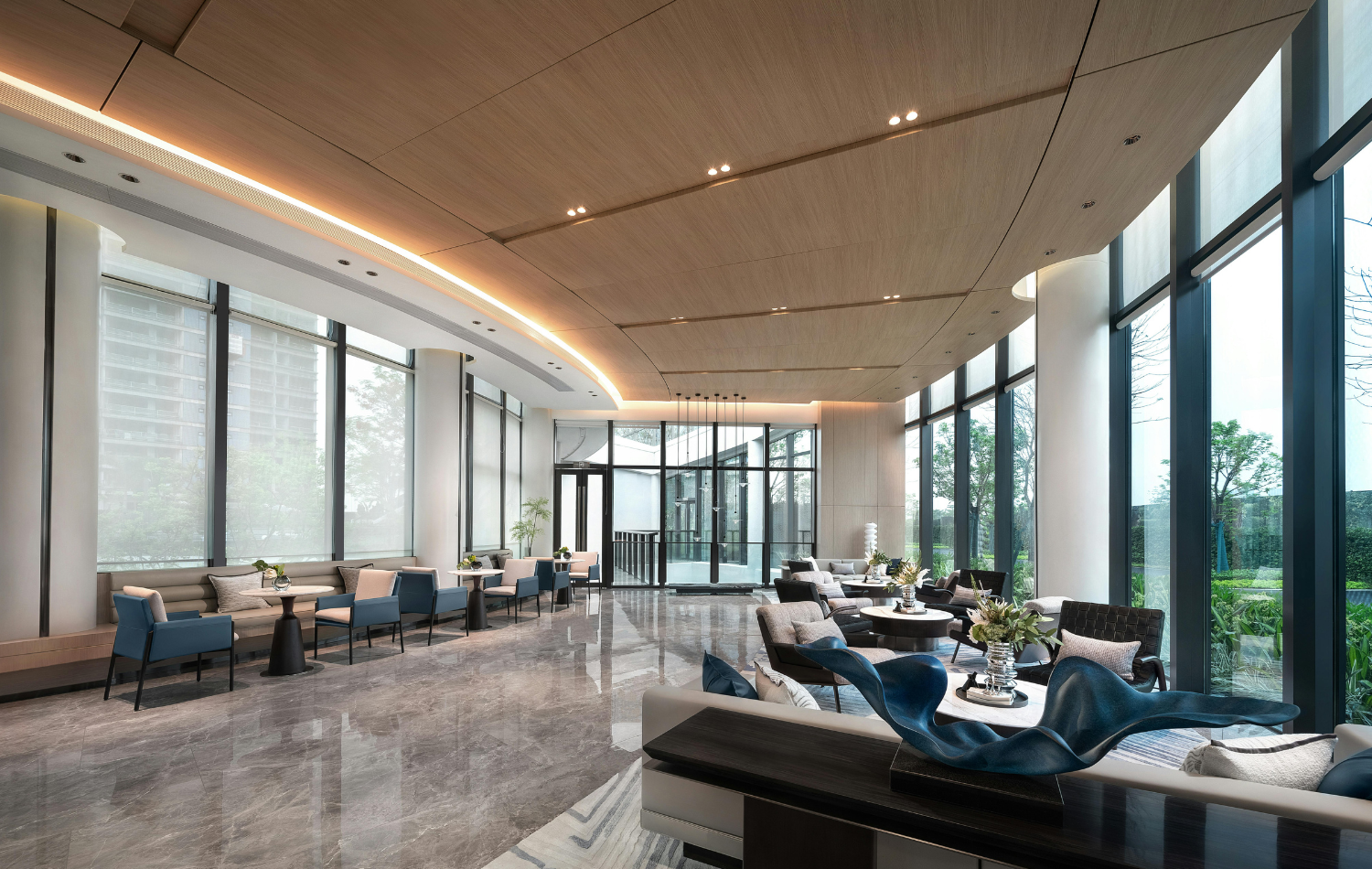 Modern hotel lobby lounge with contemporary furniture and floor-to-ceiling windows