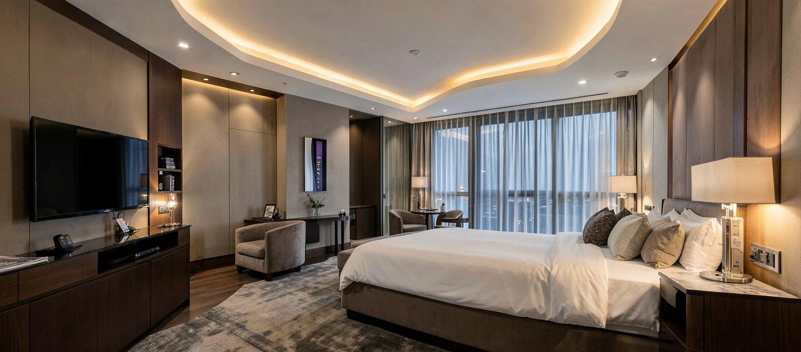 Newly renovated upscale hotel guestroom with modern furniture and in-room technology